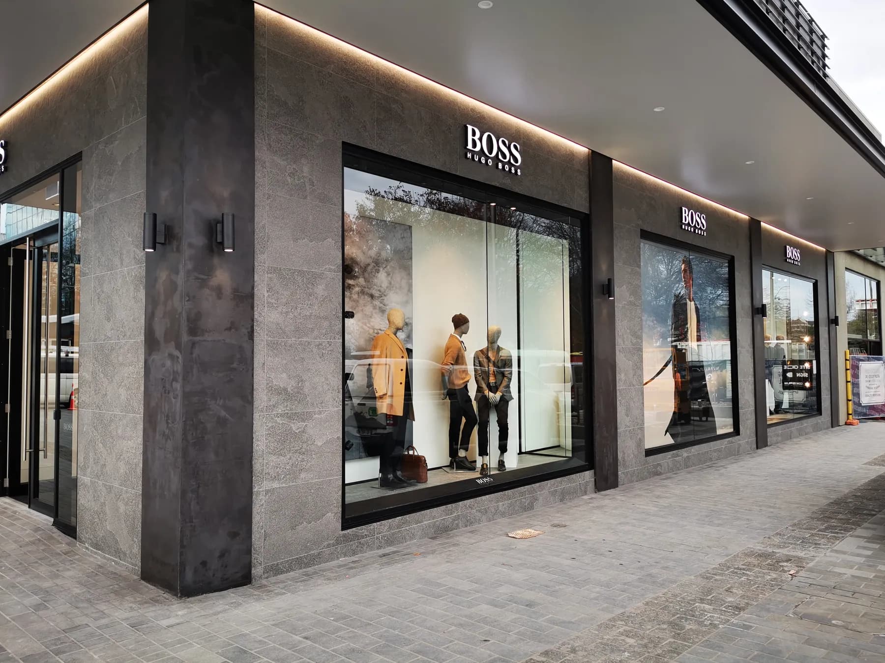 Large-format stone tiling at the Hugo Boss store Christchurch by JSR Tiling