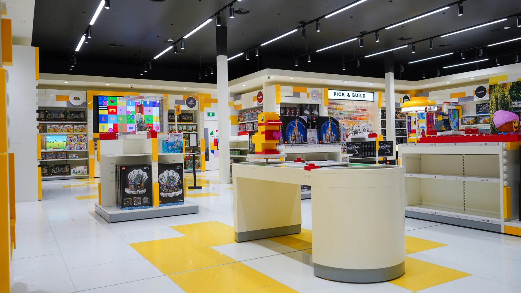 Large-format floor tiling inside the LEGO Store Christchurch by JSR Tiling